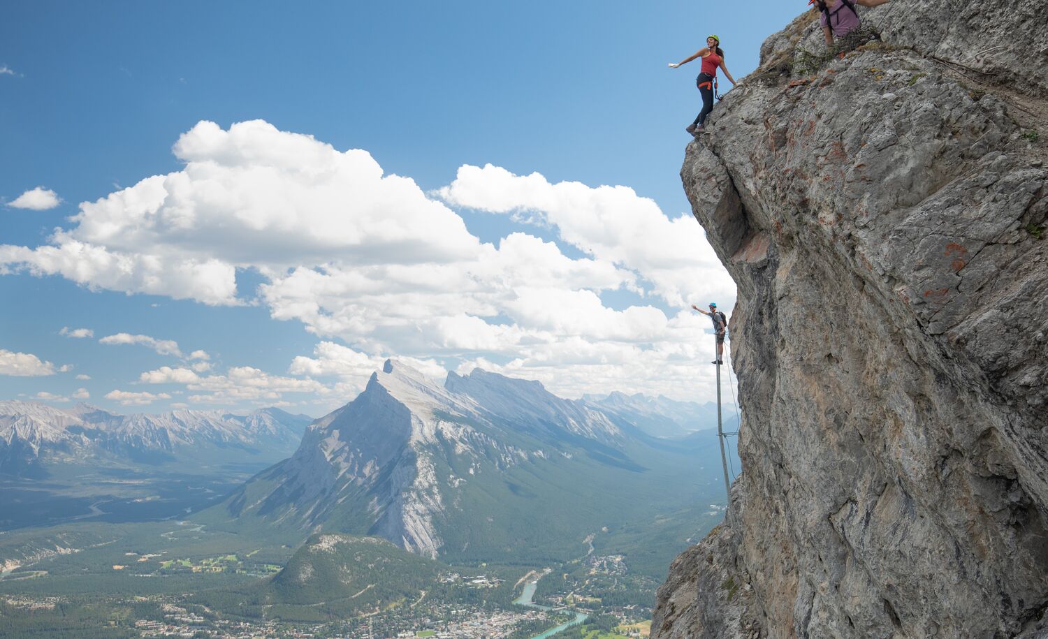 Friends enjoying via ferrata adventure at Mt Norquay